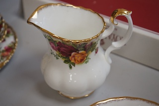 A Royal Albert Old Country Roses part tea set comprising twelve trios, a two tier cake stand, sugar bowl and cream jug. Condition - good